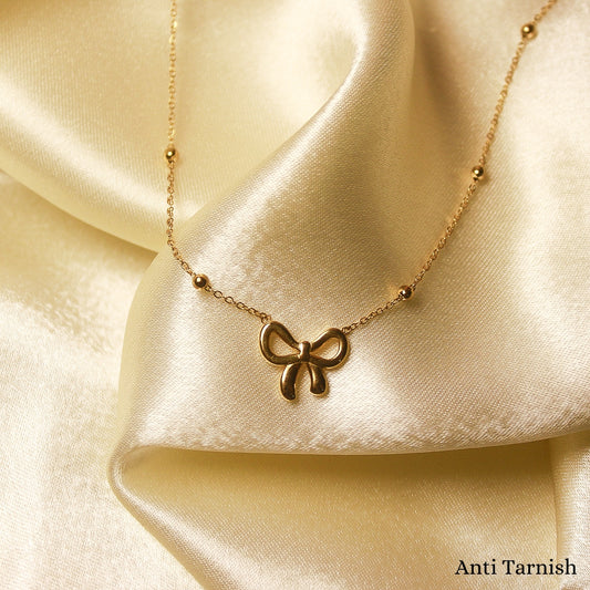 Bow necklace with beads